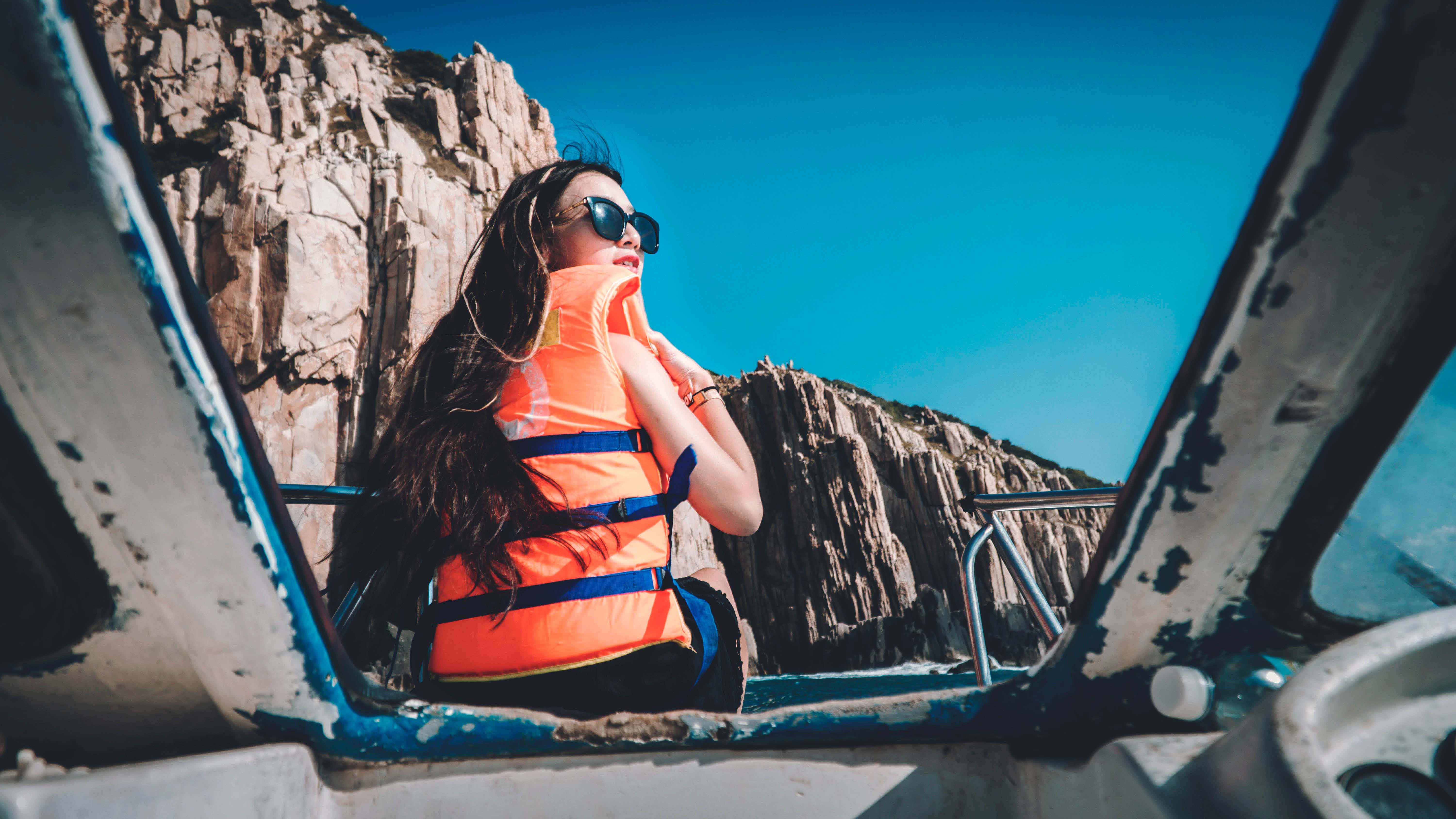 woman on boat with life jacket
